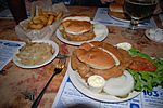 Fried-brain sandwiches, with side orders of onion rings and German fries