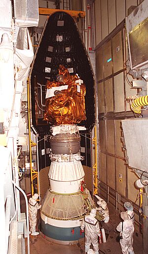 2001 Mars Odyssey being encapsulated in Delta II rocket fairing (KSC-01PP-0699)