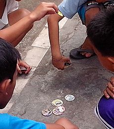 Kids playing pogs