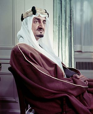 Formal photograph of Faisal, seated, facing right