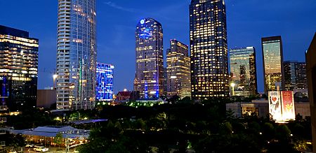 Klyde Warren Park and surrounding skyscrapers at dusk