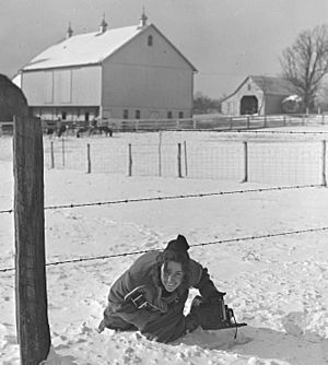 Marion Post Wolcott with Rolleiflex and Speed Graphic in hand in Montgomery County, Maryland (cropped)