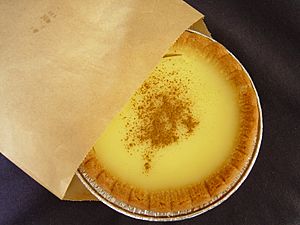 Custard tart emerging from wrapper