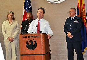 Greg Stanton at podium