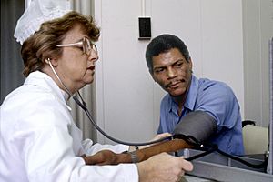 Nurse checks blood pressure