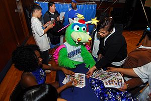 US Navy 071127-N-6936D-265 Members of the Orlando Magic Dancers and STUFF the Magic Dragon sign autographs for Sasebo Sailors and their families during the Pacific-leg of an Armed Forces Entertainment tour