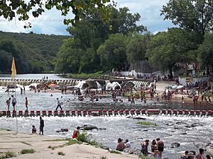 people swimming in a river