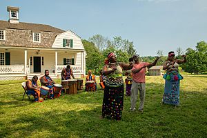 Performers demonstrate traditional African song and dance