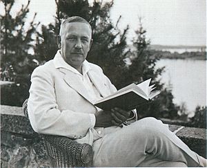 Relander sitting with book