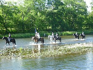 The Braw Lad and Lass crossing the Tweed on the morning of the Braw Lads Gathering