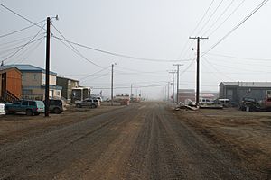 Street view of Utqiagvik in July 2008. Like all the others in Utqiagvik, this street has been left unpaved due to the prevalence of permafrost.