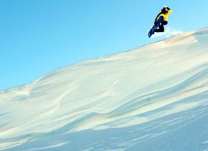 Snowboarder cornice at sugarbowl