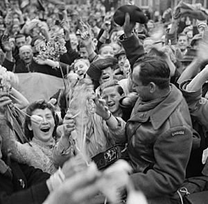 Crowd of Dutch civilians celebrating the liberation of Utrecht by the Canadian Army