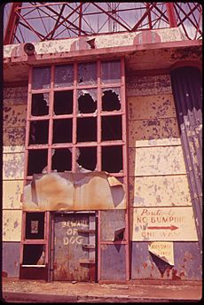 ENTRANCE TO ABANDONED PARACHUTE JUMP TOWER AT STEEPLEEHASE AMUSEMENT PARK ON CONEY ISLAND - NARA - 547894