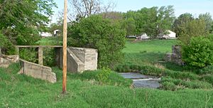 Remains of dam on Bazile Creek