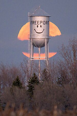 Water tower with full moon