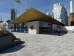 A single-storey building with a wide projecting canopy with the Underground sign on the side