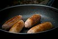 Pan frying sausages