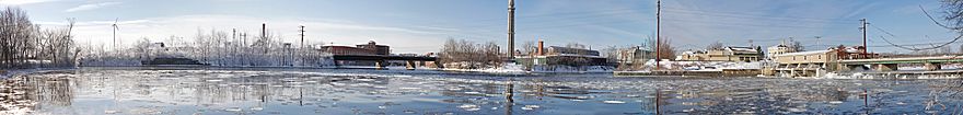 The Saco River as seen from Water Street in Saco.  To the right is Rt 1 (Elm St) crossing the river to Spring's Island in Biddeford. In the middle is the railroad bridge that serves the Amtrak Downeaster and freight trains. It crosses from Biddeford to Saco's Factory Island.