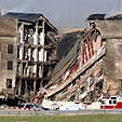 A portion of the Pentagon charred and collapsed, exposing the building's interior