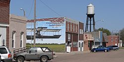 Downtown Ewing, with mural commemorating the Savidge brothers, early Nebraska aviators