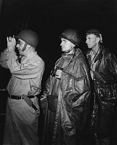 RAdm Barbey with Generals Martin and Hopkins off Saidor in January 1944