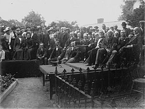 Crowd of people congregated by the grave of Robert Owen at the old parish church, Newtown (1293839)