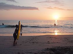 Skimboarder at hapuna beach