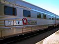 Side view of passenger car with livery of The Ghan train (Great Southern Railway)