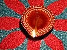 Oil lamp on rangoli.jpg