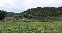 An old house and a slag heap in Boncarbo