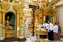 Barack Obama pours water over Friday Buddha