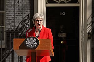 May outside 10 Downing Street, standing at a wooden lectern