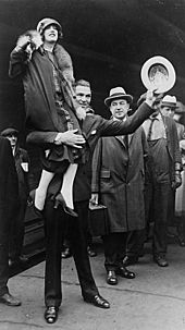 Jack Dempsey carrying his wife