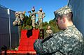 US Army 52449 1st Lt. Mike Munroe, a grader with 5th Battalion 82nd Field Artillery Regiment, 4th Brigade Combat Team, 1st Cavalry Division, monitored the time as Spc. Vincent Stringer, a Cannon Crewmember, assigne