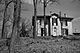 Black and white exterior view of Chiefswood and surrounding trees