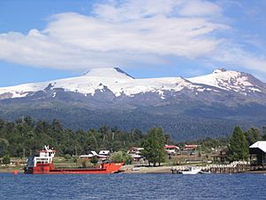 Puerto Fui and its ferry at Pirihueico Lake. Mocho-Choshuenco Volcano in the background.