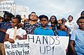 Protesters with signs in Ferguson