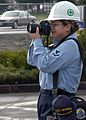 US Navy 040310-N-0130O-002 Photographers Mate 3rd Class Elizabeth Acosta, from Delano, Calif., documents work being done at a construction site