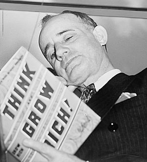 Napoleon Hill holding book 1937