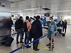 Passengers at Linate Airport in Milan have their temperatures taken