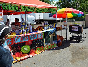 Fruit stand selling mavi at a car show in Puerto Rico