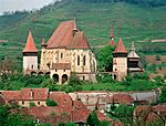 Church with surrounding walls and houses