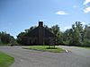 A brown brick welcome center building