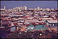 MODERN BUILDINGS TOWER OVER THE SHANTIES CROWDED ALONG THE MARTIN PENA CANAL - NARA - 546369