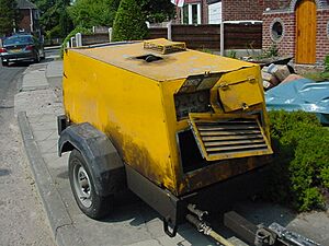 Aa pneumatic drill compressor front