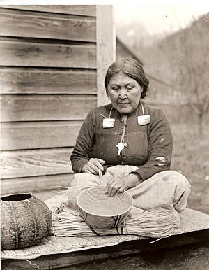 Kwakwaka'wakw woman with cedar basket.jpg