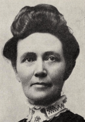 Black-and-white portrait photograph of Ida Hunt Udall in 1905, in a high-collared top and her hair done up. She looks forward, into the camera.