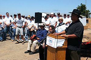 US Navy 040623-N-8770J-001 Nimitz-Class aircraft carrier USS Ronald Reagan (CVN 76) Sailors watch as San Pasqual Tribal Chairman Allen Lawson, welcomes guests to the media availability for a Habitat for Humanities project, ^ldq.jpg