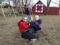 Three Boys on a Tire Swing